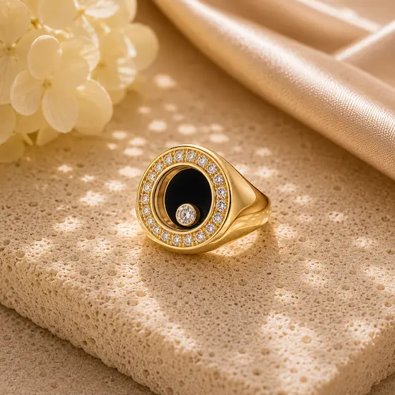 gold Monte Trevi floater ring on a coral table